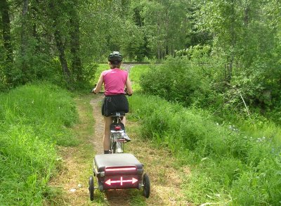 Terry on the trail, rail tracks ahead.